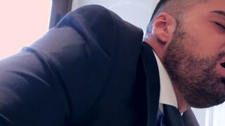 Man in a suit bangs his business partner doggystyle
