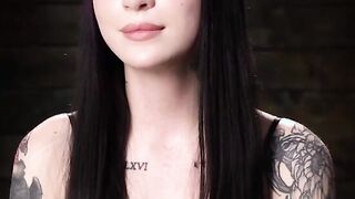 Tattooed slave suspended and flogged in dungeon