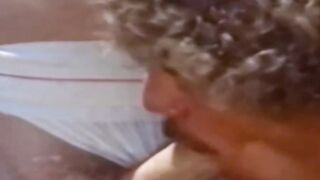A traditional blowjob competition is taking place outside between young men