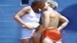 A traditional blowjob competition is taking place outside between young men