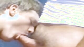 A traditional blowjob competition is taking place outside between young men