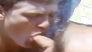 A traditional blowjob competition is taking place outside between young men