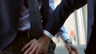 Men in suits enjoy a rough session of steamy sex at work