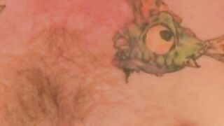 Tattooed stud chilling before jerking big cock for cumshot