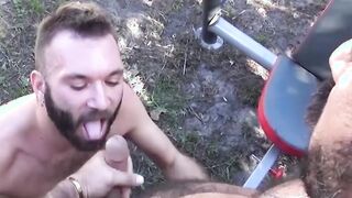Tattooed stud blows big dick outdoor for huge cum eating