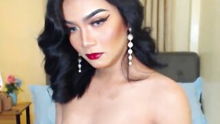 Asian shemale fucks flashlight on webcam show