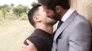 Fucking a guy outside who is dressed elegantly in a suit and tie