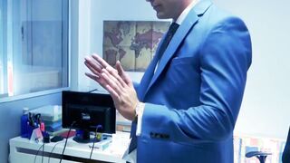 Muscular executive in a suit stuffing his cute buff employee