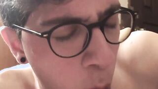 A Latino jock with tattoos sports seductive glasses while playing hot BJ