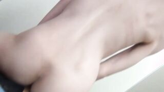 Skinny Japanese babe rides and sucks a small dildo in POV