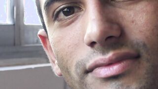 Unmarried Latino straight man soliciting money while baring his back