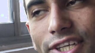 Unmarried Latino straight man soliciting money while baring his back