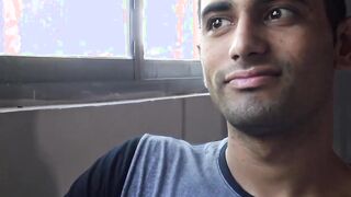 Unmarried Latino straight man soliciting money while baring his back
