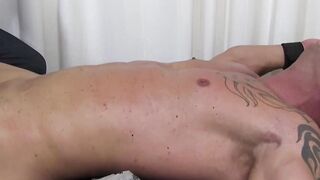 Masculine hunk strapped down for hard tickling session