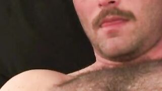 Hairy stud shoots a thick load after intense masturbation