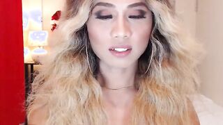 Blonde shemale wanks off in chair in front of webcam
