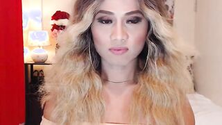 Blonde shemale wanks off in chair in front of webcam