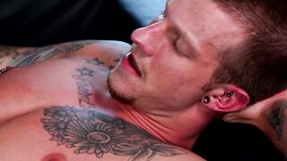 Tattooed jock anally drilled with dildo by his kinky lover