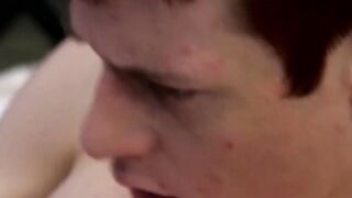 Cutie jerks off on the bed while holding a large dildo inside of him