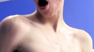 Cutie jerks off on the bed while holding a large dildo inside of him