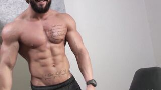 Bearded guy Zack Lemec shows off his muscles during jerk off