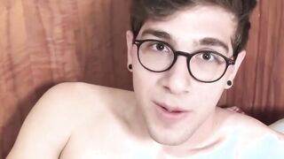Tattooed Latino jock wears seductive glasses during hot BJ