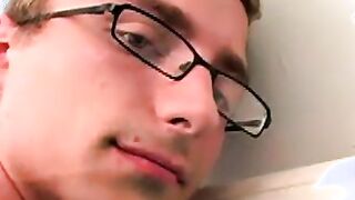 Geeky amateur with glasses and tattoos strokes his big cock