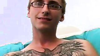 Geeky amateur with glasses and tattoos strokes his big cock