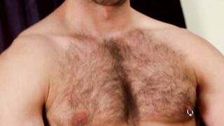 Masked hairy hunk is stroking his big fat cock solo