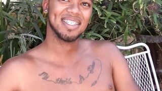 Youthful black person flaunts his balls and jerks off performance