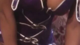 A curvaceous latex vixen dominates a young darkskinned beauty