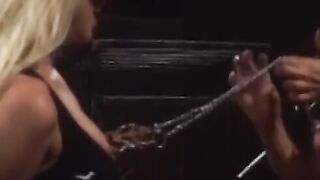 Redhead domina punishes a lesbian sub with a megadildo