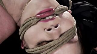 Bound babe electrically stimulated in suspension