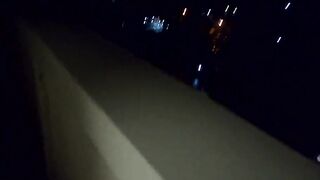 The women give a oral sex on a outdoors balcony, and then walks with a cum on her face