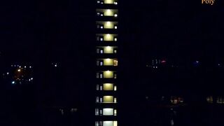 The women give a oral sex on a outdoors balcony, and then walks with a cum on her face