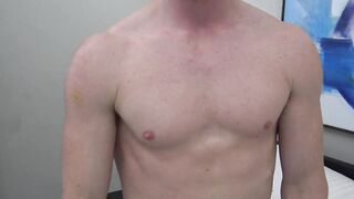 Rogan Reid loves to look into the camera as he gets hard and caresses his cock