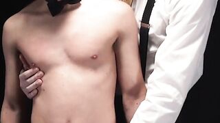 Master Anthony Divino bends the boy over before running his fingers along his hole