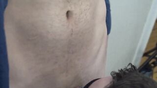 Logan Carter watches as the sexy man kneeling before him works on his cock without he