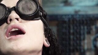 Blindfolded and chained to a column