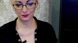 Blonde MILF takes off bra on webcam