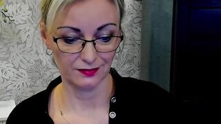 Blonde MILF takes off bra on webcam