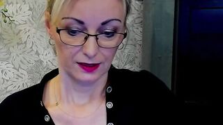 Blonde MILF takes off bra on webcam
