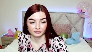 Cute redhead babe chats on webcam