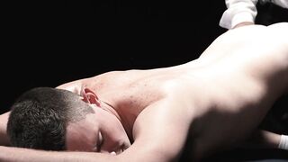 Master Felix Kamp slides a dildo onto the boy's tight hole while he handjobs his dick