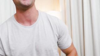 Muscular dude Damien White masturbates solo in front of the camera
