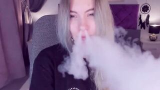 Blonde teen SimaDark smoking vape and stripping off on solo webcam show
