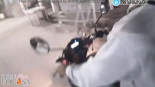 erotic into the street on top of the motorcycle showing titties with Joao O Safado