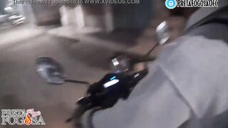 erotic into the street on top of the motorcycle showing titties with Joao O Safado