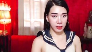 Asian shemale schoolgirl jerks off