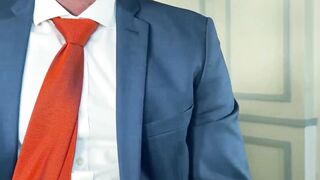Suited Isaac Gomes passionately jacks his long throbbing cock